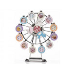 A silver-plated musical Ferris wheel with photo frames, featuring a teddy bear in the center, crystal surrounded apertures, and metal decorations.
